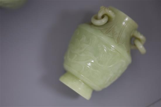 A pair of Chinese carved jade vases and covers, height 12cm